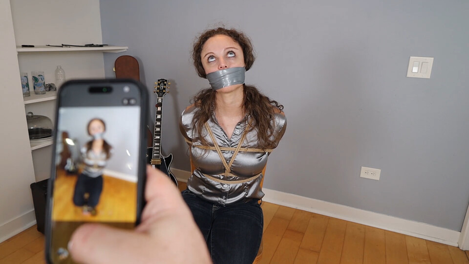 Amber Jonez a babysitter tied up and wraparound tape gagged during a cops n' robbers game